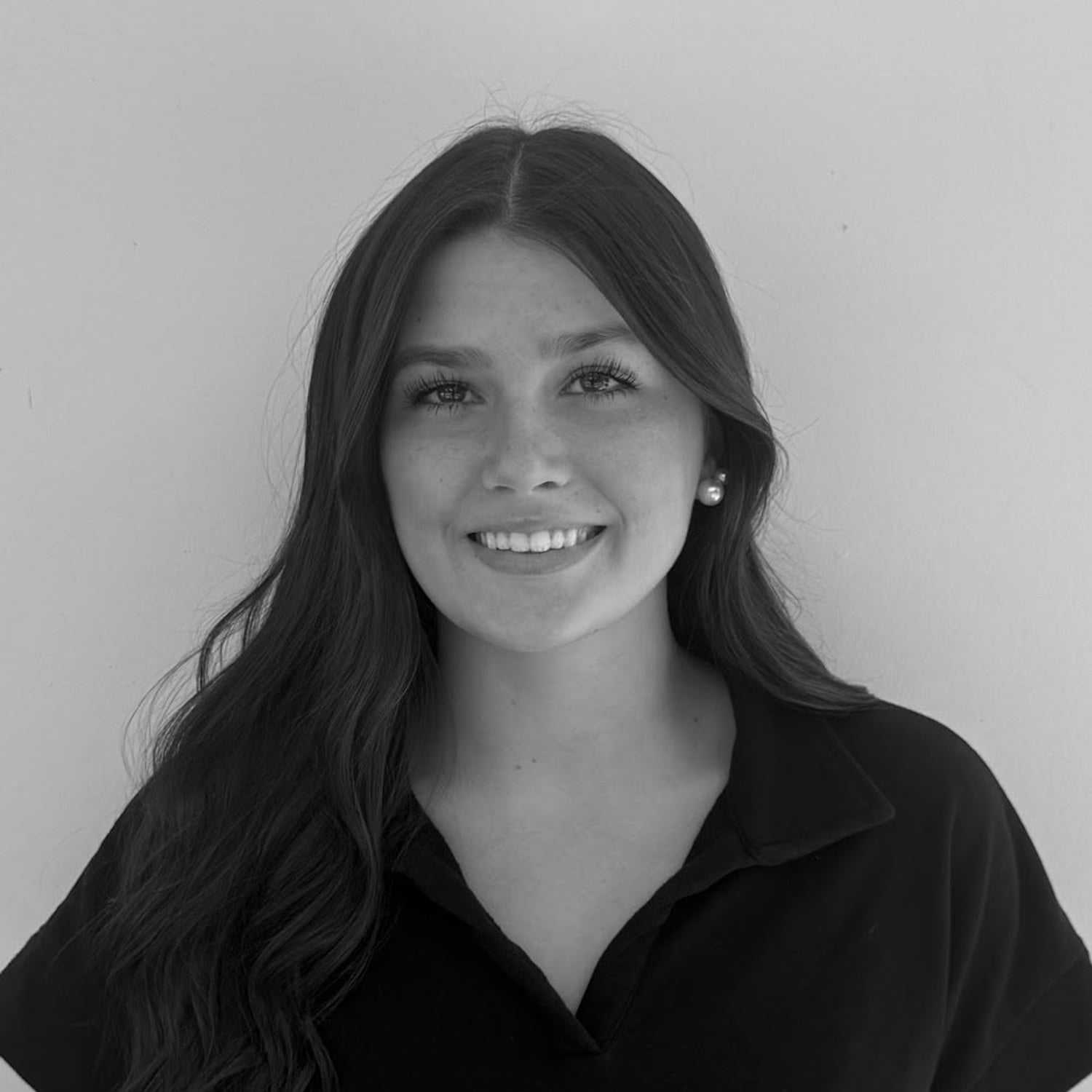 Portrait of Grey Privette, a professional stylist at Indigo, showcasing their expertise and style.