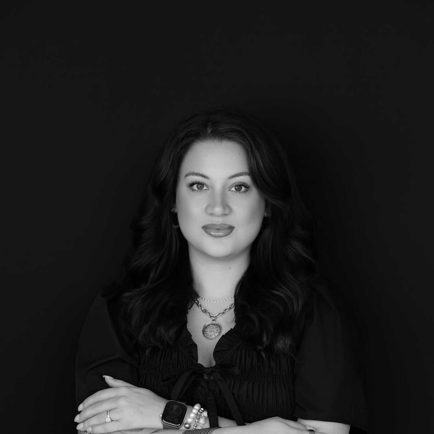 Portrait of Emily, a professional stylist at Indigo, showcasing their expertise and style.