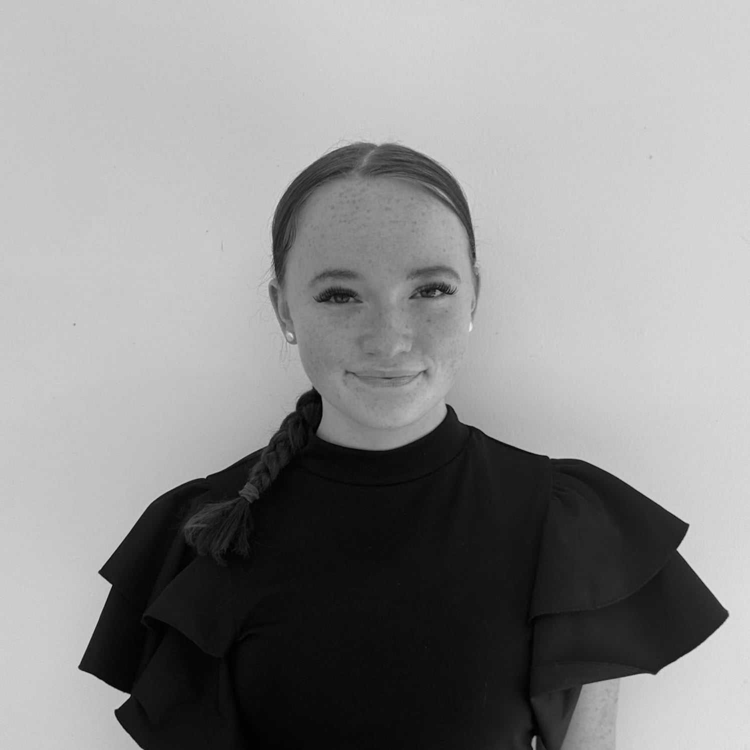 Portrait of Madyson Jenkins, a professional stylist at Indigo, showcasing their expertise and style.
