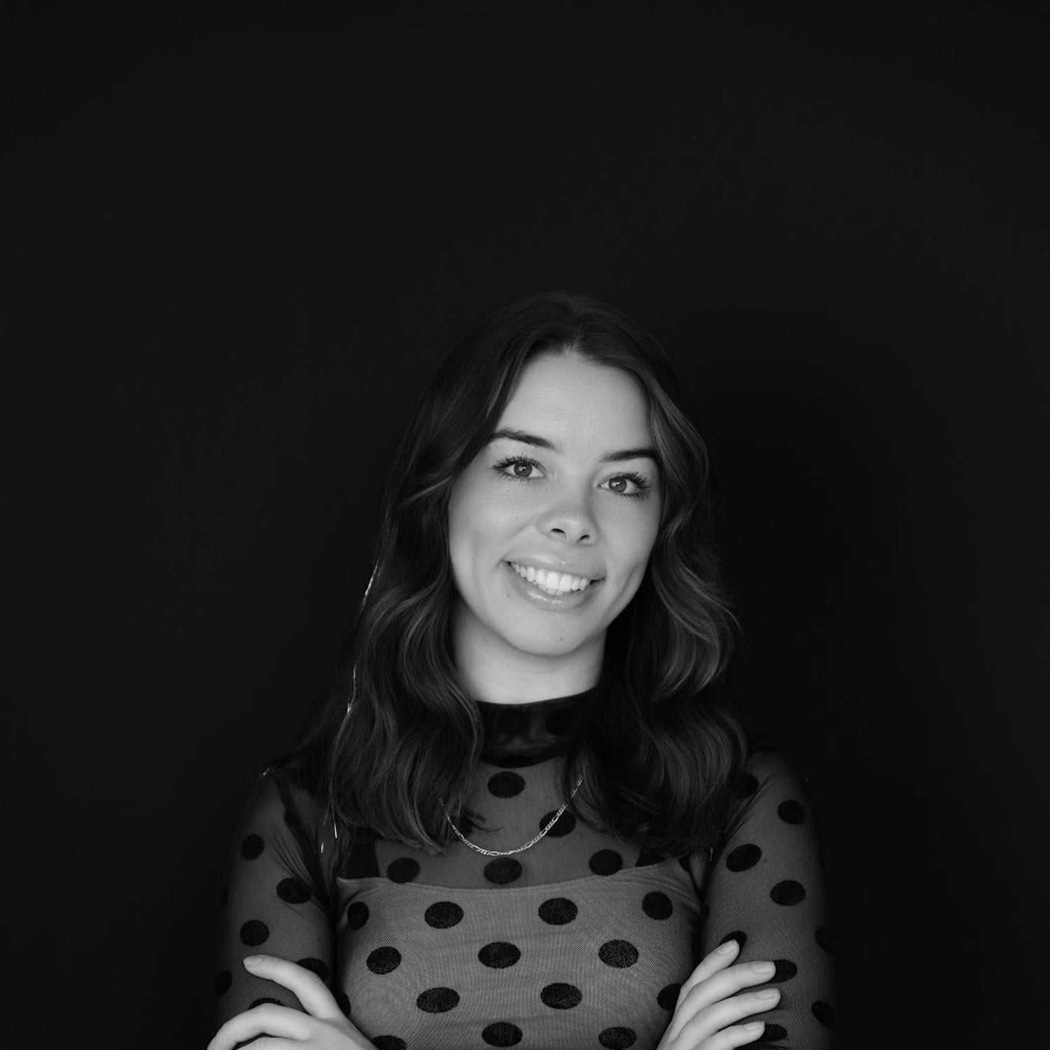 Portrait of Savanna, a professional stylist at Indigo, showcasing their expertise and style.