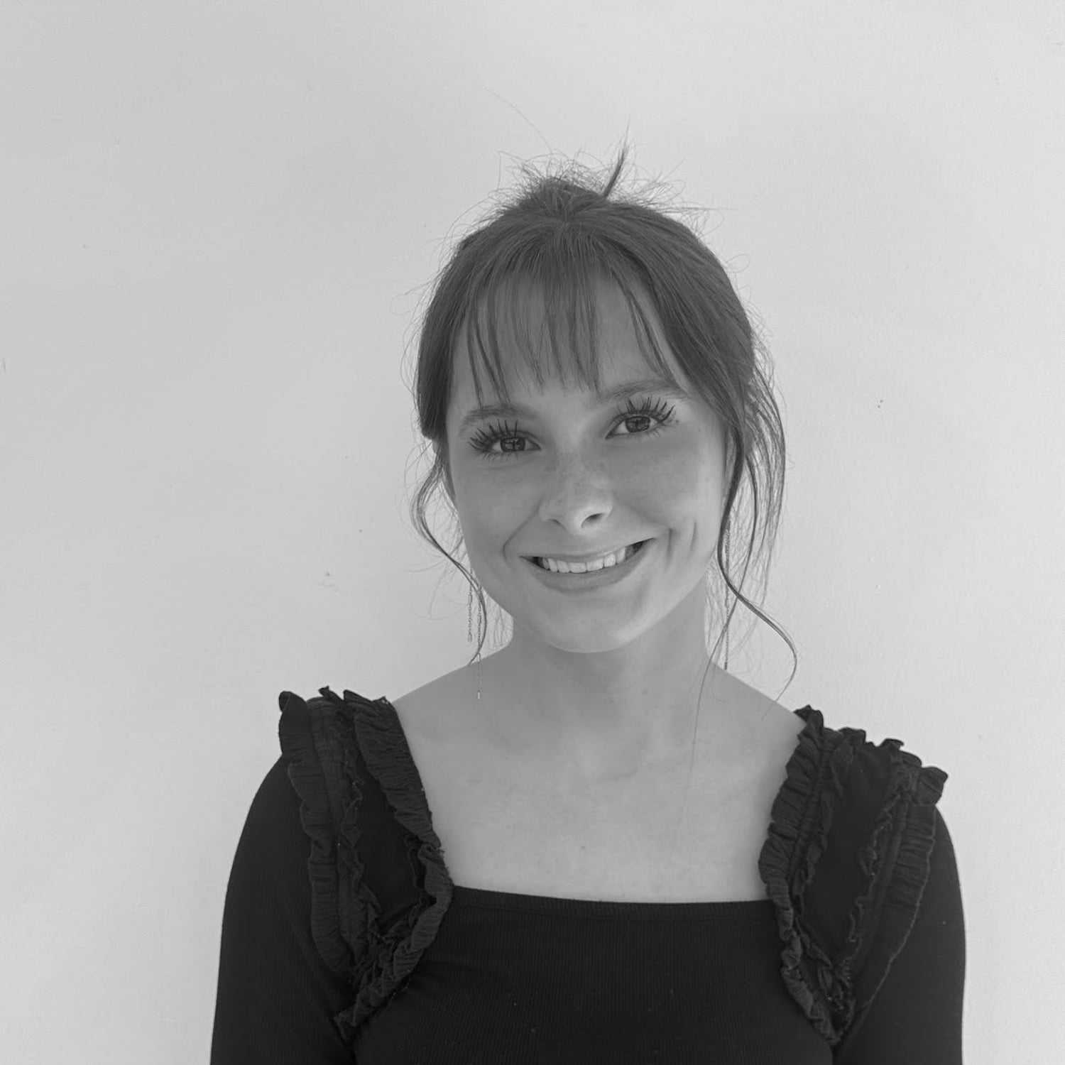 Portrait of Katherine, a professional stylist at Indigo, showcasing their expertise and style.